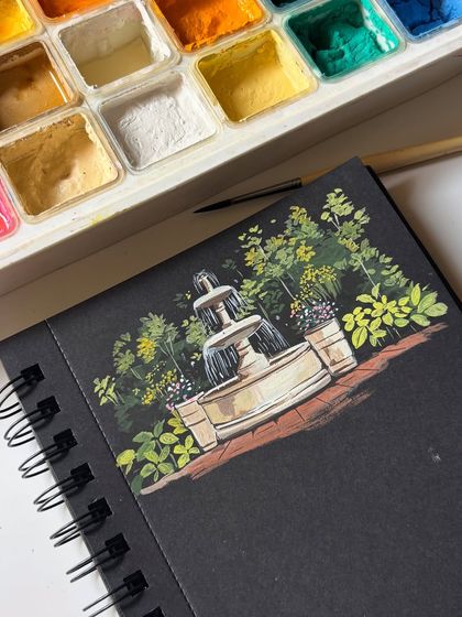 The finished gouache painting of a garden fountain surrounded by lush greenery. The black paper provides a great contrast that makes the scene feel like it's glowing.