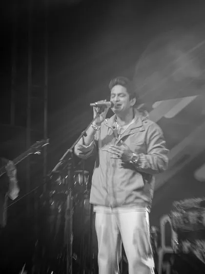 I use different editing styles to match the mood of the music. This black and white shot uses a slow shutter speed to create a sense of motion and energy during the performance.