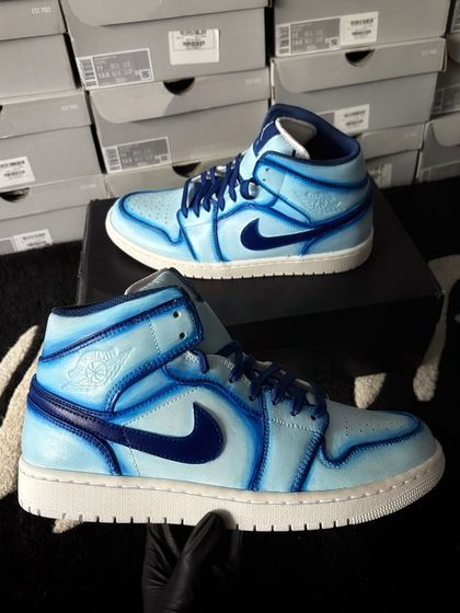 Another angle of the blue cartoon custom Jordans.