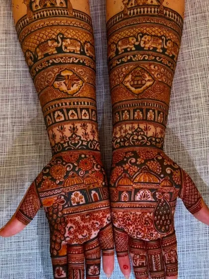 A very dense and dark stained bridal mehndi, filled with traditional Indian architectural and floral patterns.