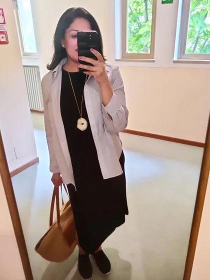 For a day trip to Limone sul Garda, I layered a striped cotton shirt over a long black dress. This is a great styling trick for adding interest and coverage to a simple dress.