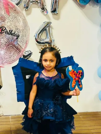 Celebrating Maavi's 4th birthday with a magical butterfly theme! The birthday girl is all smiles with her own handcrafted butterfly wand, ready for a day of creative celebration.