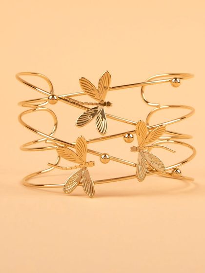 A front-on shot of the multi-layered dragonfly cuff.