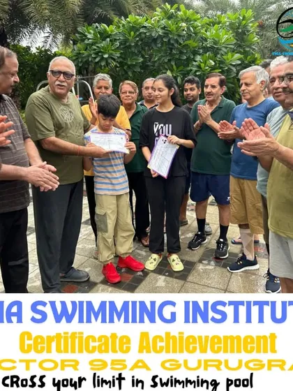 A young swimmer receives his achievement certificate, surrounded by applause from our senior members. This shows the supportive, cross-generational community we've built at FMA.