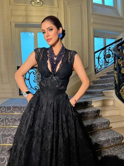 A close-up of the Paris glam look, showing the defined eye, flawless skin, and the way the makeup complements the stunning black gown.
