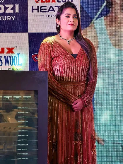 A candid moment on stage during the Lux dealer meet. I am always alert and ready, ensuring the event flows seamlessly.