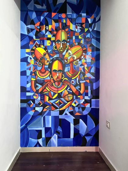 This is another mural for the same tattoo studio, this time a cubist-inspired painting of African figures. The geometric shapes and a monochrome blue palette with pops of color create a very modern and artistic look.