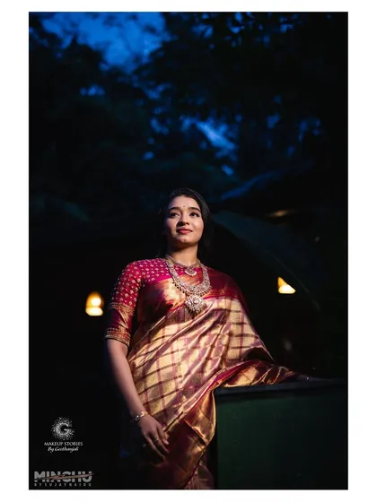 A dramatic, low-light shot of Priyanka at her reception. Even in the dark, her makeup looks flawless and her skin has a beautiful, natural glow.
