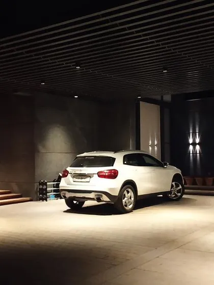 Even functional spaces like a driveway and parking area are an opportunity for thoughtful lighting design. Here, we used recessed downlights to provide safe, ample illumination while maintaining a clean, sophisticated aesthetic that complements the home's architecture.