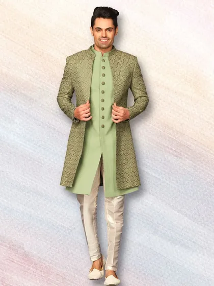 A beautiful pastel green sherwani with a geometric pattern. This is a great option for a Mehendi or Haldi ceremony, offering a fresh and elegant look.