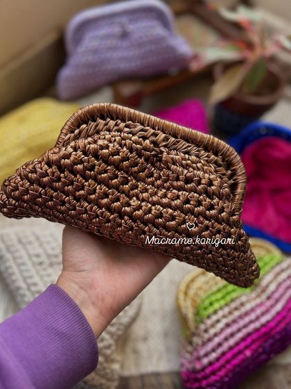 A close-up of our bronze metallic yarn clutch. The shimmer is subtle yet eye-catching, perfect for adding a touch of glamour to your evening wear.