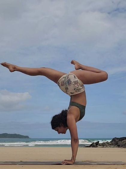 A powerful handstand variation on the beach. On Dussehra, this pose reminds me of conquering inner demons and finding strength and light within.