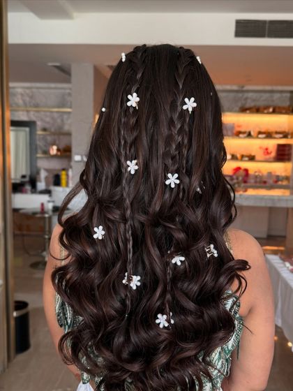 Another angle of the Mehandi braids, showing the placement of the small floral clips.