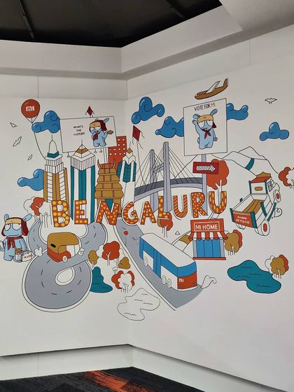 The completed corner mural for Xiaomi, featuring their mascot exploring our city. This is how we turn a corporate space into something fun and unique.