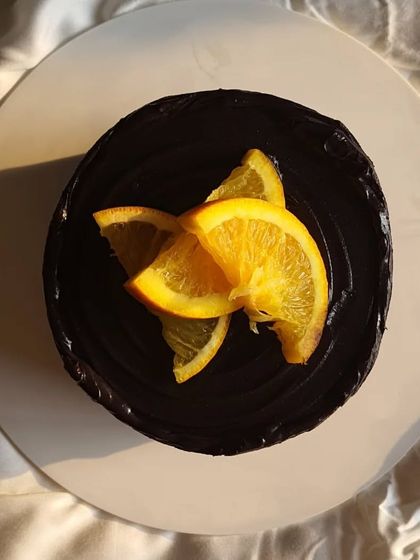 A top-down view of the Mandarin Chocolate cake, showcasing its minimalist beauty.