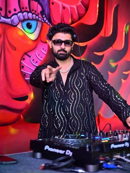 Pointing to the crowd at Tipsy Bull, getting them ready for the next drop.