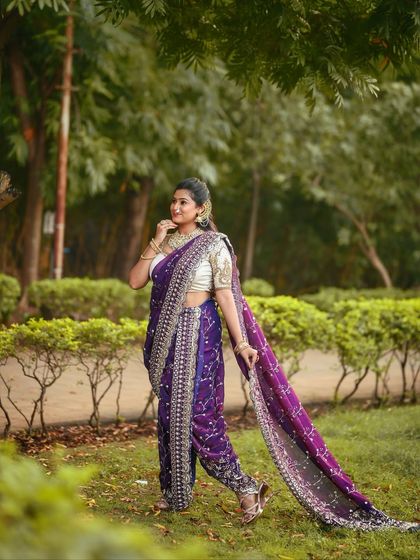 A graceful walking pose in an outdoor setting, showing how the purple Nauvari looks in natural light.