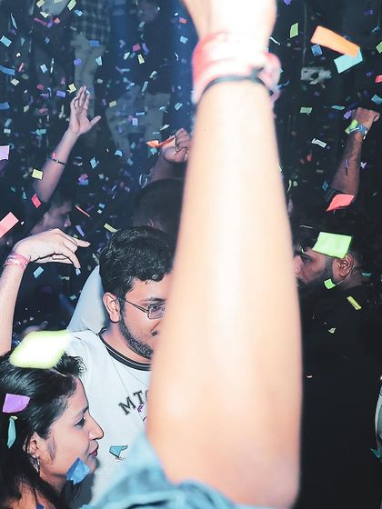 A confetti shower over a packed dance floor. This is the peak energy moment at Sugar Factory.