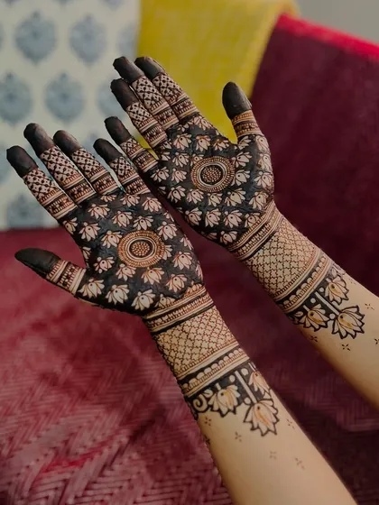 Another angle of the modern lotus design, showing its beautiful symmetry and the striking contrast between the dark henna and the skin.