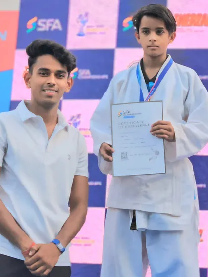 A proud moment with my student and his certificate of excellence at the SFA Championship.