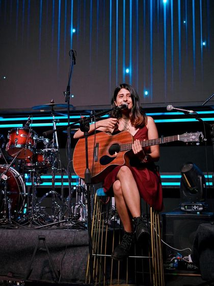 Another shot from the White Lotus Club, showing the full band setup with the beautiful blue stage lighting.