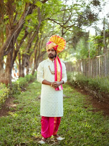 A classic portrait pose, looking off into the distance. The tree-lined path creates a beautiful leading line.