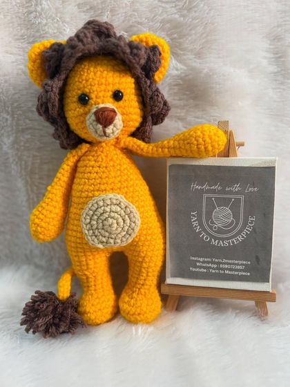 A majestic and friendly lion toy, complete with a fluffy mane and tail. This amigurumi lion is ready to rule the playroom.