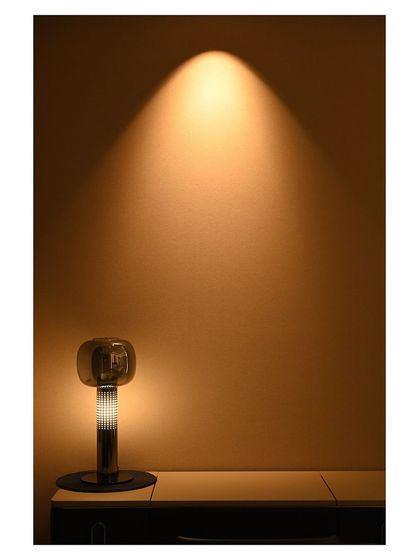 This single spotlight on a modern table lamp demonstrates how even small light sources can be used to create a dramatic effect. Every light in the home can be part of the automation system.