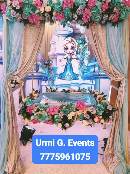 For those who want a fairytale welcome, I designed this 'Frozen' princess theme. The setup includes a castle backdrop for the baby's cradle, surrounded by beautiful blue, pink, and white floral arrangements.