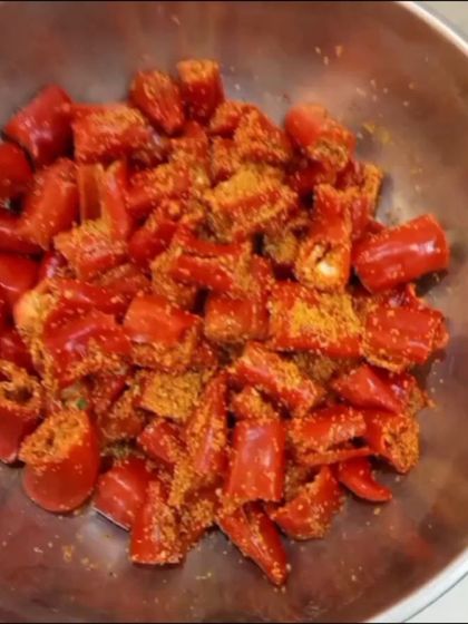 The red chillies are mixed with my freshly ground masala mix. This step is crucial for developing the rich and aromatic flavour of the final red chilli pickle.