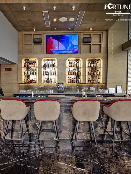 The sleek and modern bar at Neptune, with its clean lines and well-organized display of spirits.