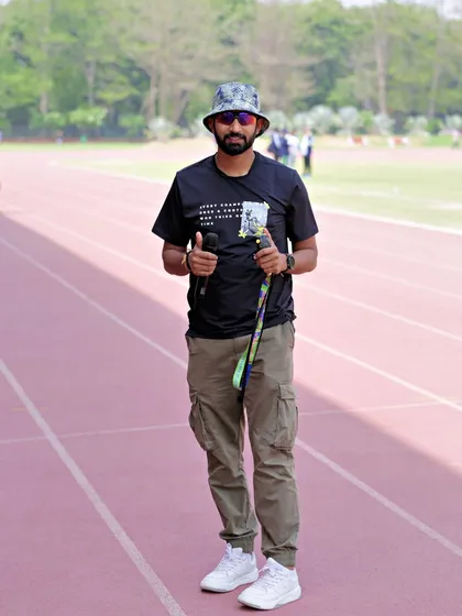 On the field at the Khelo Masters Games. I use a stopwatch and other tools to ensure accurate performance tracking for over 2500 master athletes.