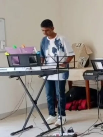 The other half of the talented duo, this student plays the keyboard part for the energetic "Goan Masala" piece.