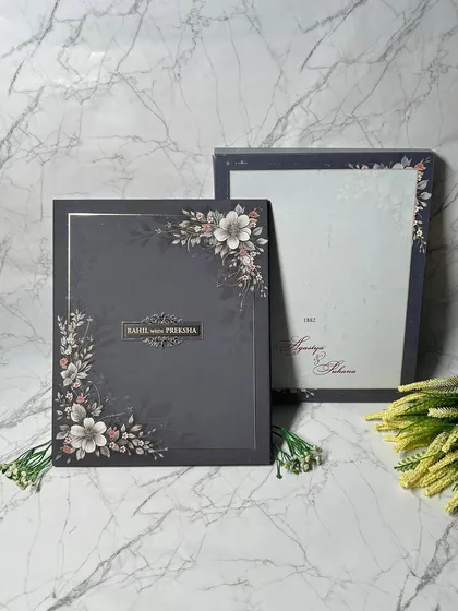 I love the drama of a dark, moody palette. This luxurious invitation suite pairs a sophisticated charcoal background with soft floral illustrations and elegant typography, creating a bold and unforgettable first impression.