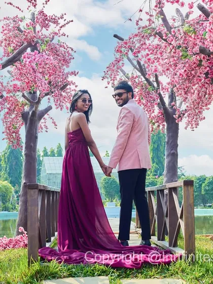 You don't need to fly to Japan to experience the beauty of cherry blossoms. We captured this couple's story amidst our vibrant, handcrafted cherry blossom trees, creating a romantic and picturesque pre-wedding memory.