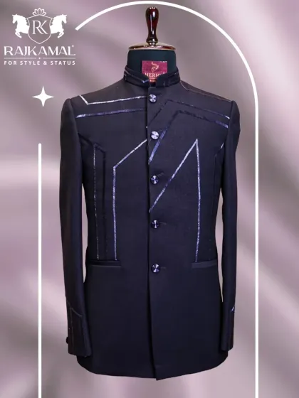 A full front view of a black Jodhpuri jacket with sharp, silver-lined geometric patterns, offering a bold and timeless fit.