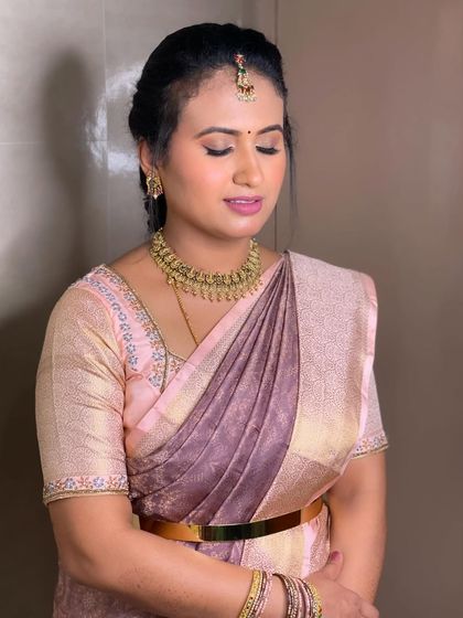 Swathi's look for her brother's engagement. We opted for a softer, pastel-toned look to match her beautiful saree.