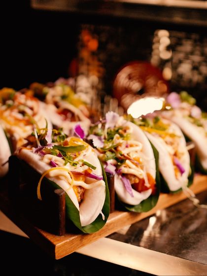 Fluffy steamed bao buns filled with delicious, savoury fillings and fresh garnishes. A modern Asian street food classic, elevated for a luxury experience.