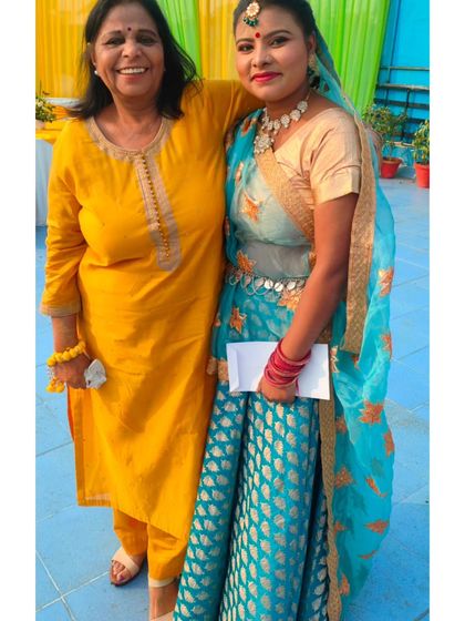 A happy moment with a client after a folk dance performance. Building relationships and seeing smiles on our clients' faces is what we love most.