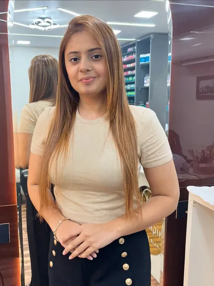 A full view of this confident client and her new hair color. The highlights add a beautiful dimension to her straight hair.