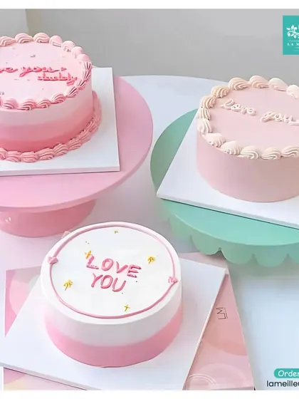 For those who love understated elegance, I design minimalist Korean-style cakes. These bento cakes feature simple pastel ombre frosting and personalized messages like 'Love You', making them perfect for intimate celebrations, anniversaries, or just because.