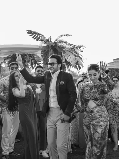 A black and white shot capturing the lively dance floor at the Cuban Jazz brunch. The theme encouraged a fun, carefree atmosphere that got everyone moving.