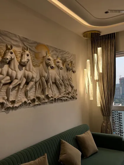 The way the modern chandelier lighting hits the details of this horse sculpture is just beautiful. It highlights the depth and craftsmanship of the mural.