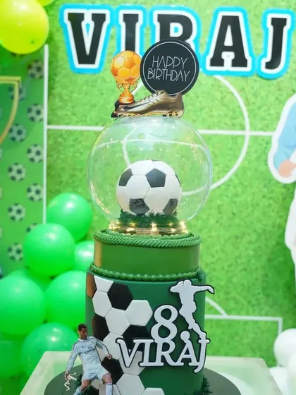 Even the cake gets in on the theme! This amazing football cake was the centerpiece of the celebration, complete with a player figurine and a golden boot trophy.