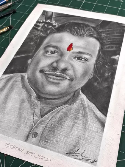 A pencil sketch on Brustro drawing paper. The addition of the red tilak provides a striking pop of color on the otherwise black and white graphite portrait, drawing the eye immediately.