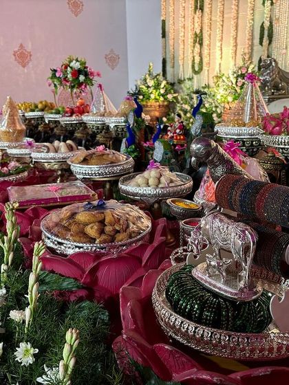 A view of the offering table featuring lotus-shaped bowls and bangle displays.