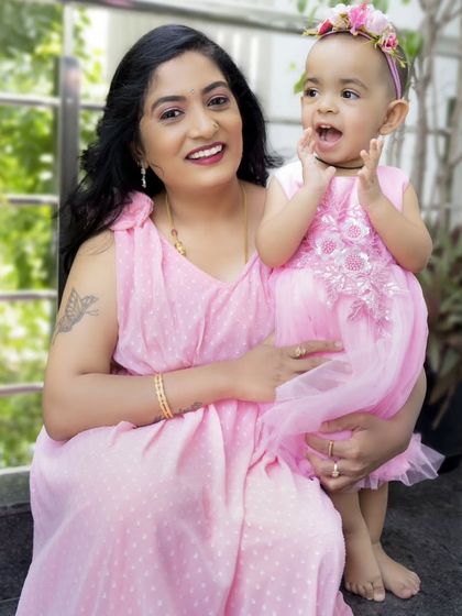 An outdoor shot from the Mother's Day session, capturing a candid and joyful moment between mother and daughter.