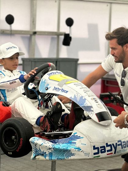 A coach from the prestigious Baby Race Driver Academy provides instruction to one of our drivers.
