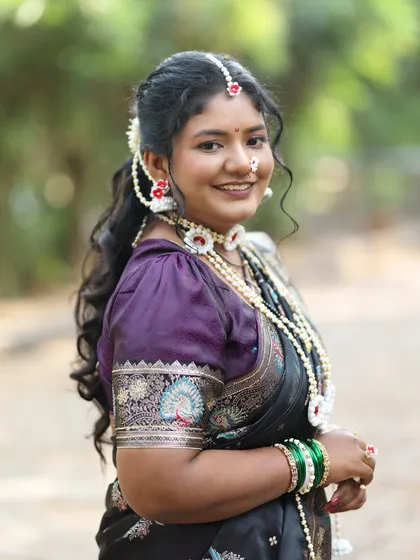 A close-up of the special 'halwyache dagine' or sugar jewellery, traditionally worn for Makar Sankranti. I offer these delicate, handcrafted sets to complete your festive look, along with a classic black saree.