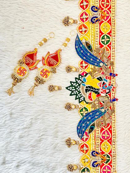 This complete set includes a Radha Krishna bandhanwar and matching Shubh Labh hangings. The design is perfect for creating a spiritual and festive ambiance for Diwali.